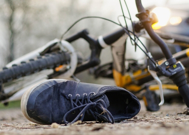 Child's sneaker next to a wrecked bicycle after a fatal accident, Teenager Killed In Bicycle
