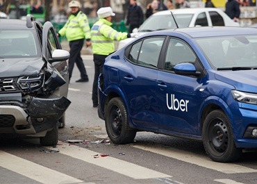 Rideshare car (Uber) accident with police present. Title: Compensation After A Ride-Sharing Accident Is Crucial.