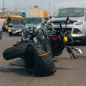 Motorcycle lying on the sidewalk after a serious crash in East Brunswick