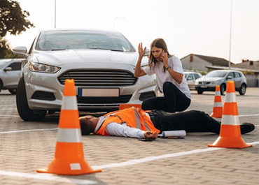 Construction worker injured after being hit by a car near traffic, relevant to personal injury
