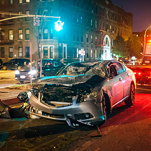 Car crash at night in city with rescue emergency service – New Brunswick Car Accident Lawyer