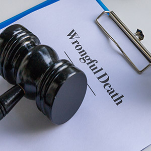 Wrongful death legal document clipped on desk – New Brunswick Lawyer