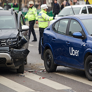 Uber car involved in accident with traffic police standing in background – Edward Blinder, New Jersey rideshare accident attorney