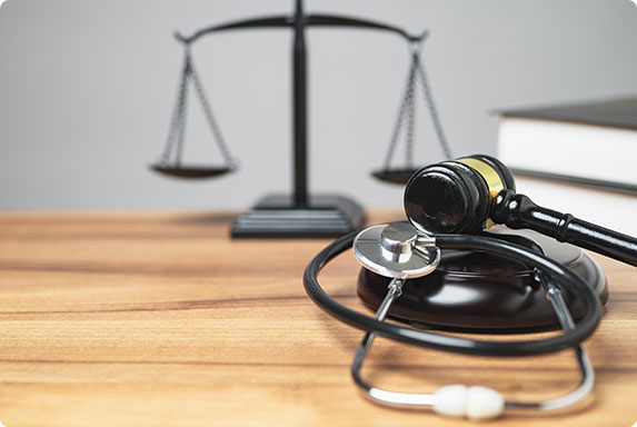 Stethoscope and gavel with Scales of Justice, representing  personal injury law.